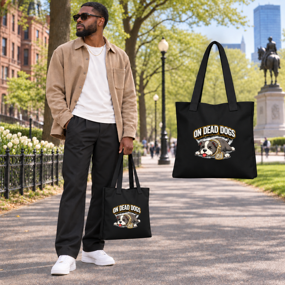 Black adult model in Boston with On Dead Dogs tote and larger production graphic