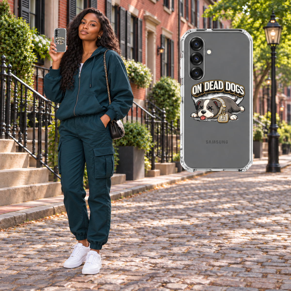 Black adult woman in Boston holding On Dead Dogs clear Samsung Galaxy S25 case, matching floating case at right. Phone not included.