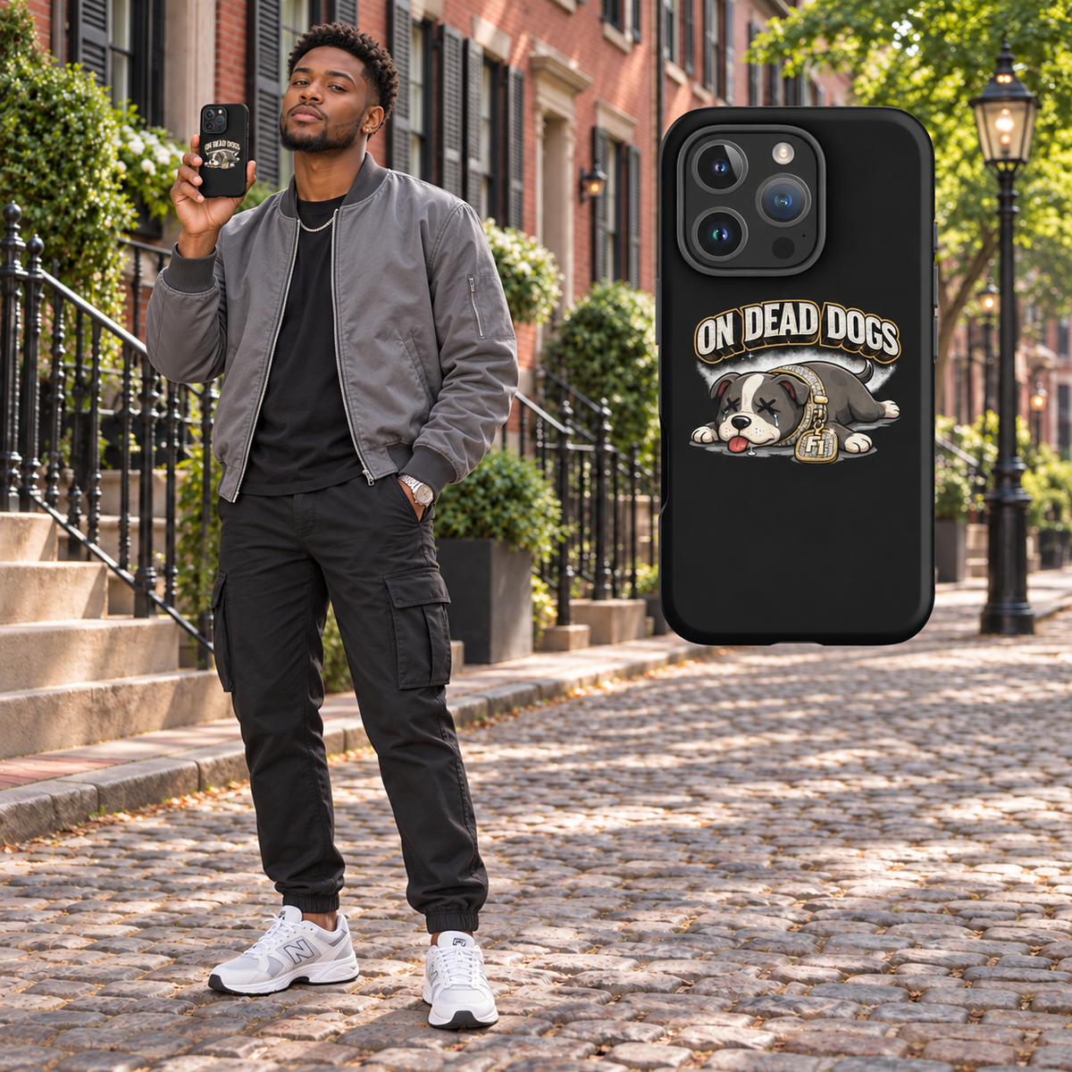 Black adult model in Boston holding the black On Dead Dogs matte tough iPhone 16 Pro case, matching enlarged case at right. Phone not included.