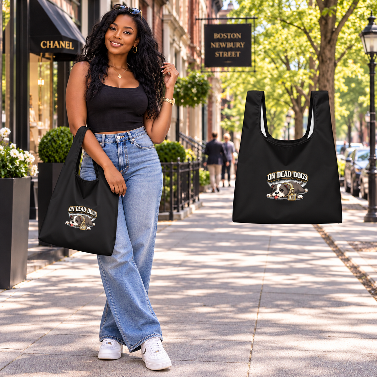 Black adult model with On Dead Dogs shopping bag in Boston, with matching floating accessory.