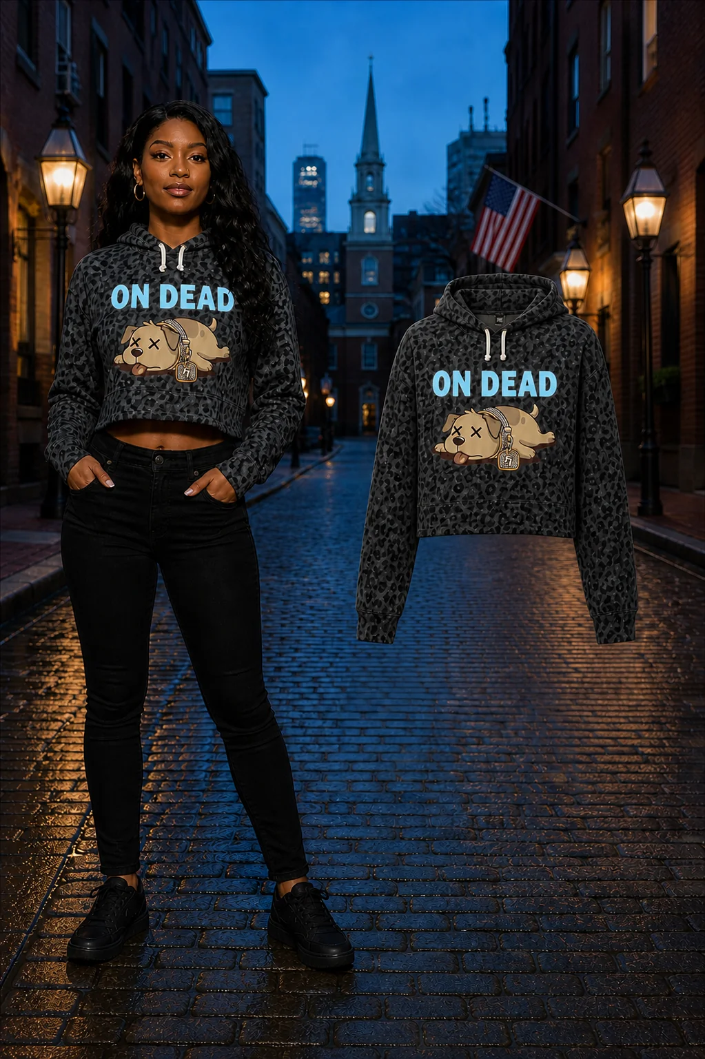 Female model wearing the Black Leopard On Dead cropped hoodie beside the matching floating garment on a Boston street