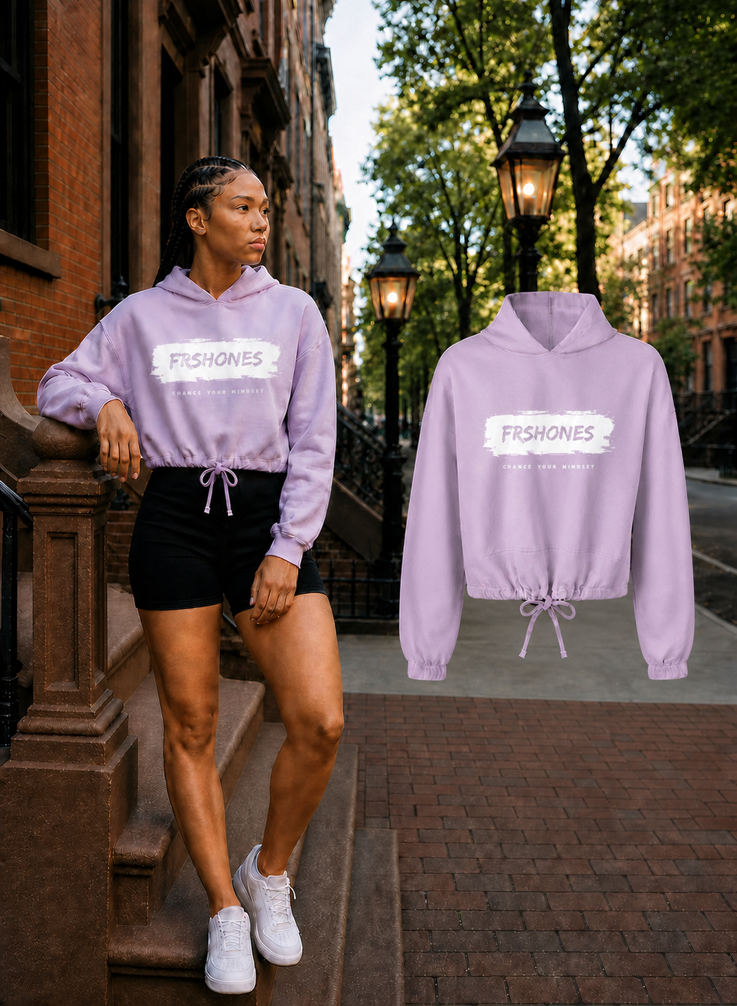 Female model wearing the Lilac Stroke of Genius cropped hoodie beside the matching shoulder-aligned floating garment on a Boston brownstone street