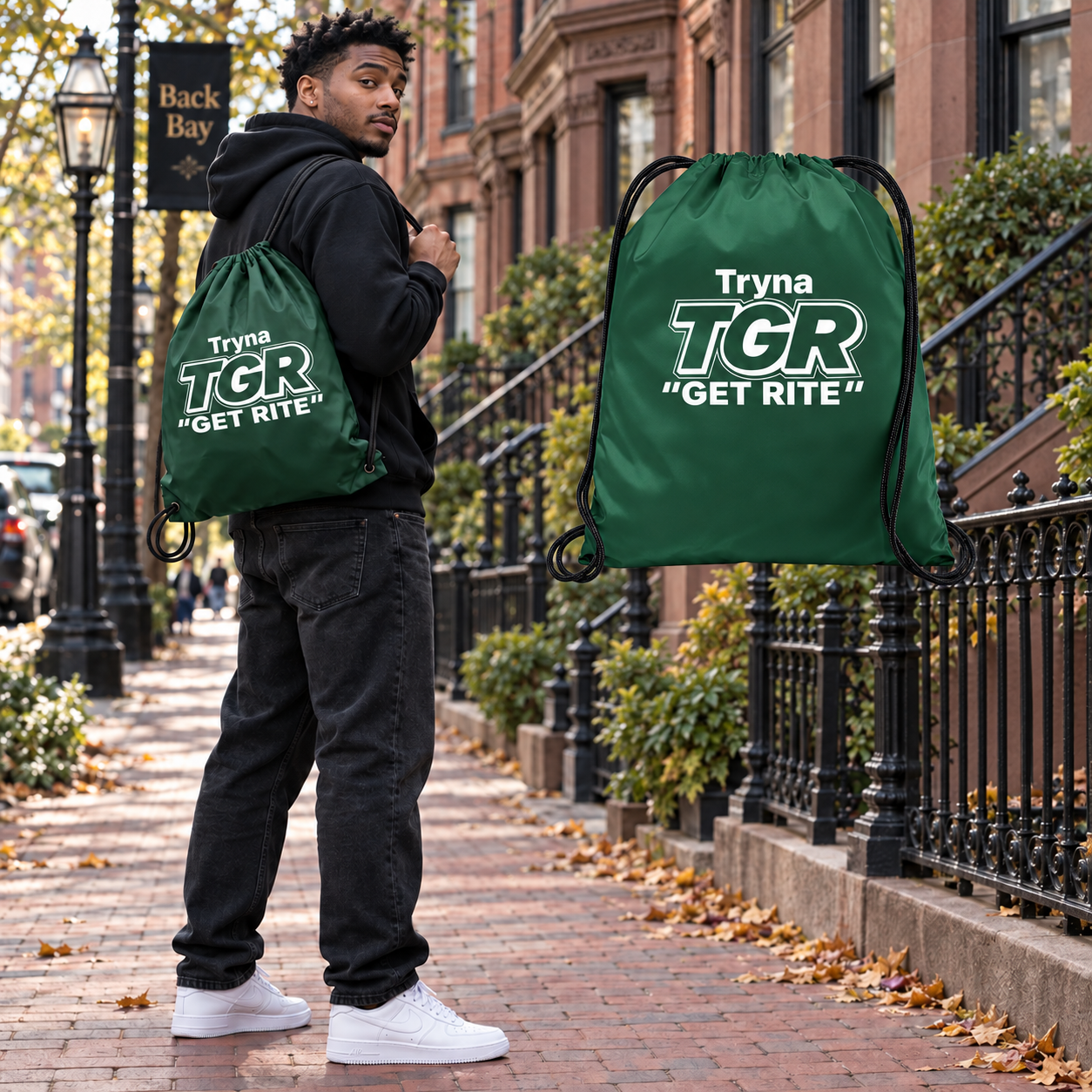 Model carrying the Forest Green TGR bag beside its matching floating bag in Boston