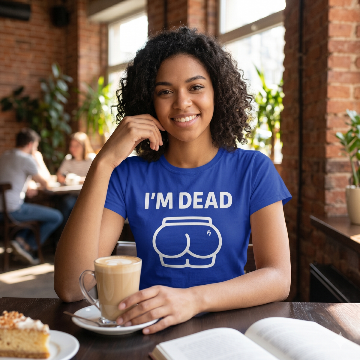 Person wearing a blue t-shirt with 'I'm Dead' graphic in a casual setting