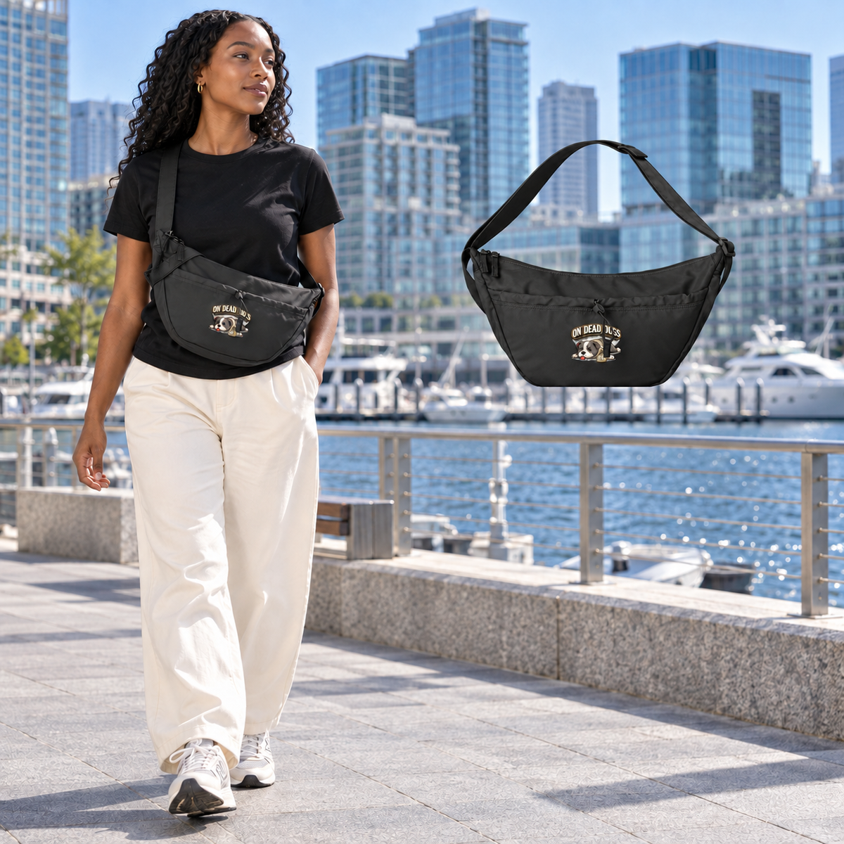 Black adult model in Boston wearing the On Dead Dogs Everyday Crossbody Bag, with a matching floating black bag.