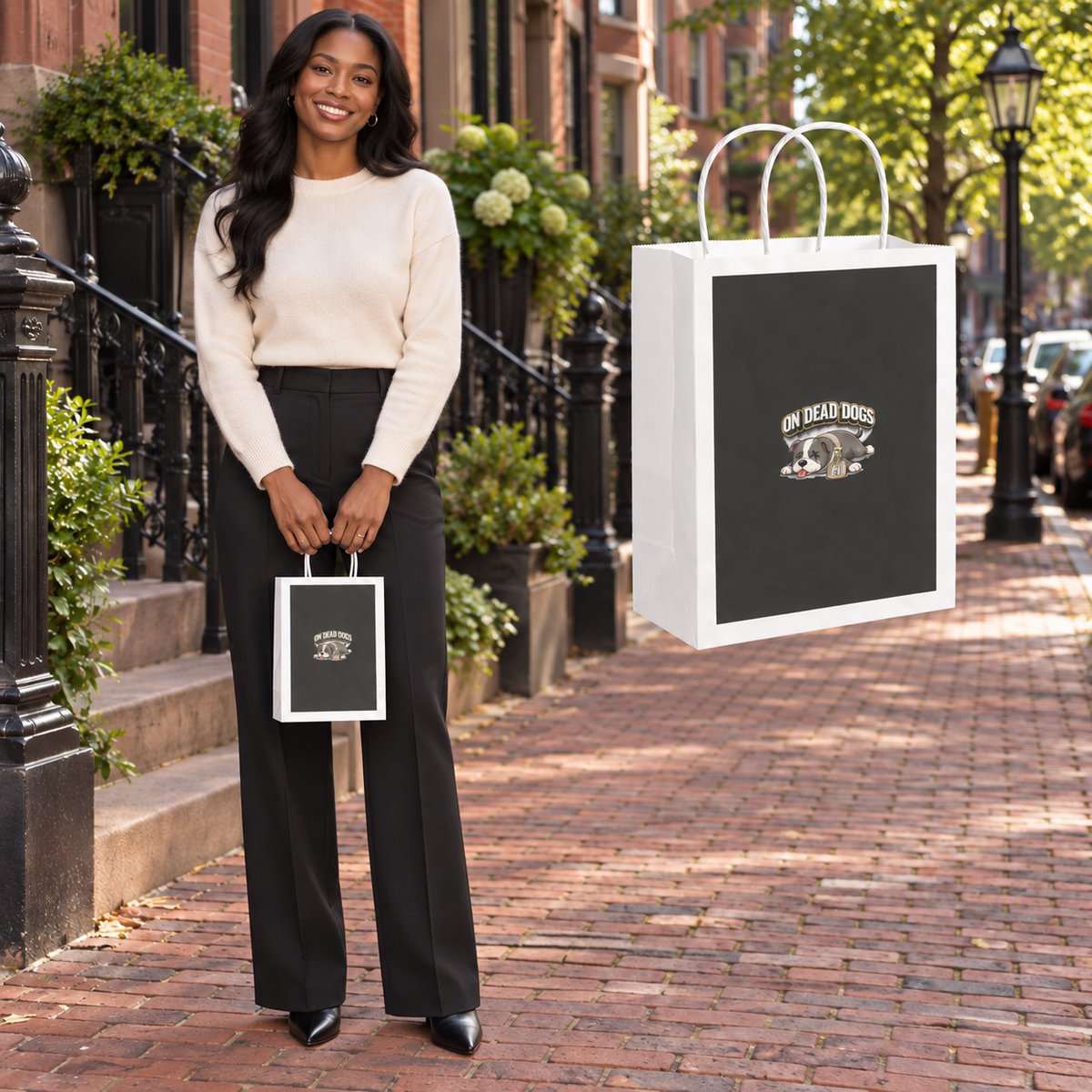 Black adult model with On Dead Dogs gift bag in Boston, with matching floating accessory.