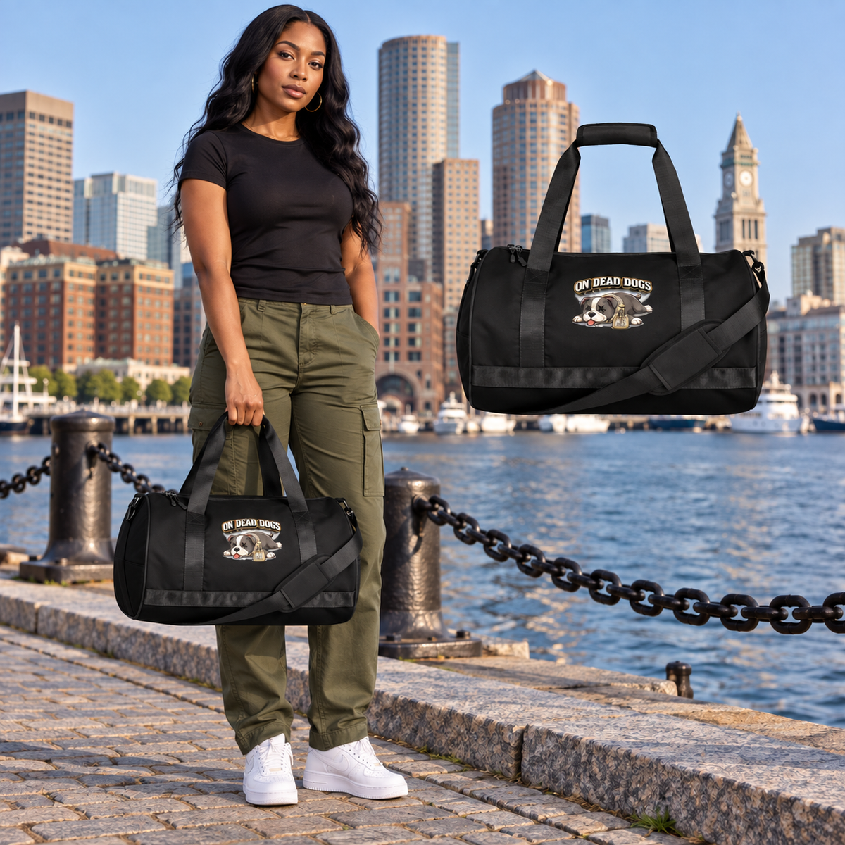 Black adult model with On Dead Dogs gym bag in Boston, with matching floating accessory.