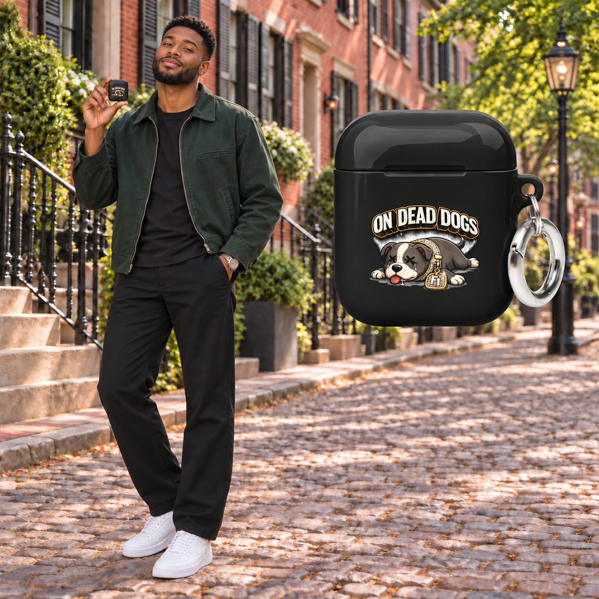 Black adult man posing in Boston with the glossy On Dead Dogs AirPods case and matching floating product