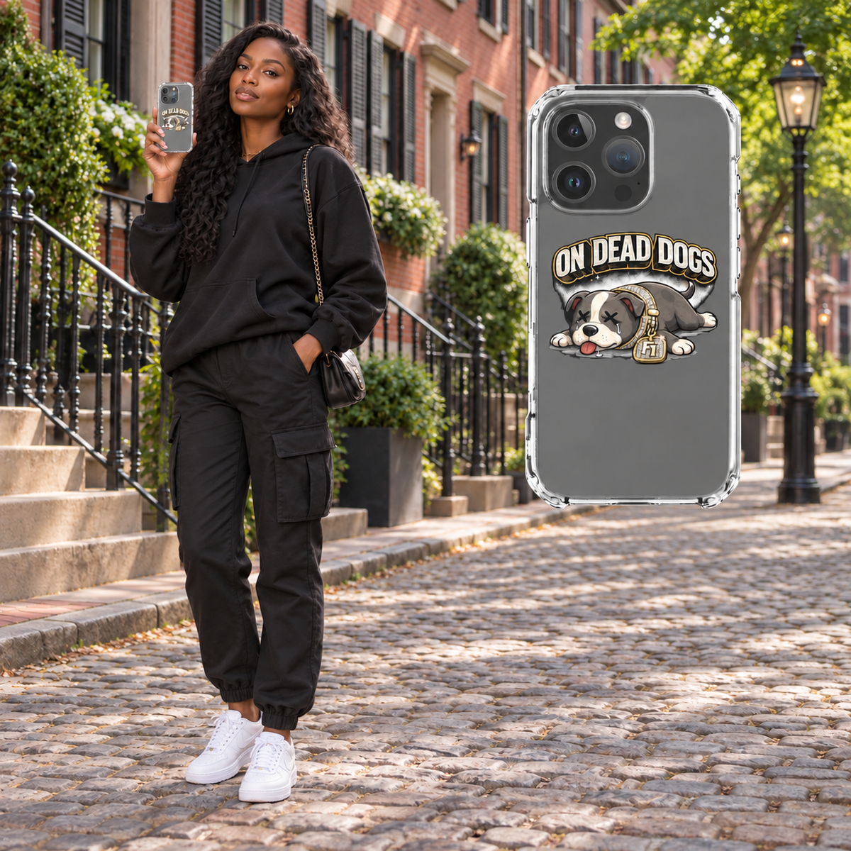 Black adult model in Boston holding the On Dead Dogs clear iPhone 16 Pro case, with matching enlarged case at right. Phone not included.