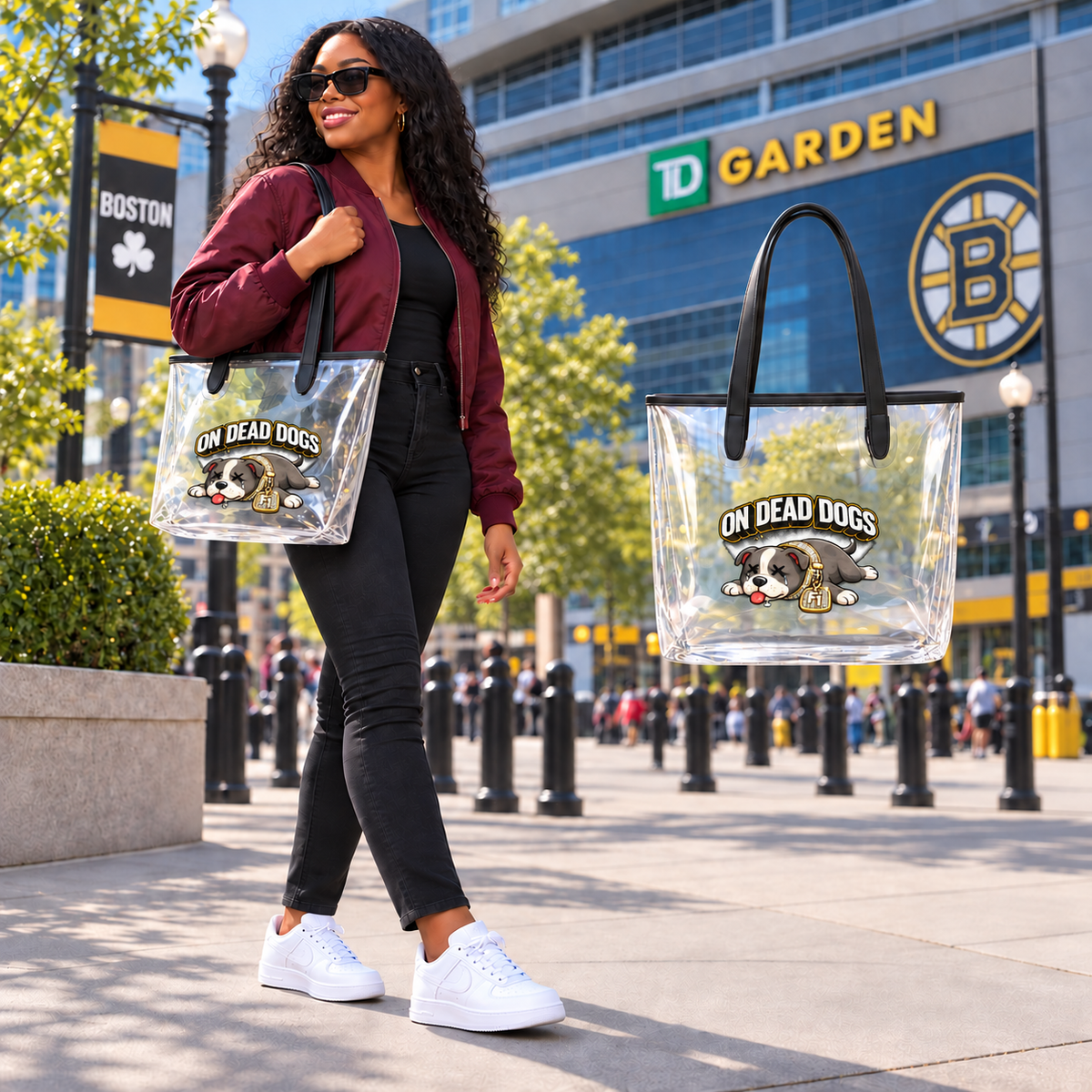 Black adult model outside TD Garden Boston carrying clear On Dead Dogs tote with enlarged front artwork