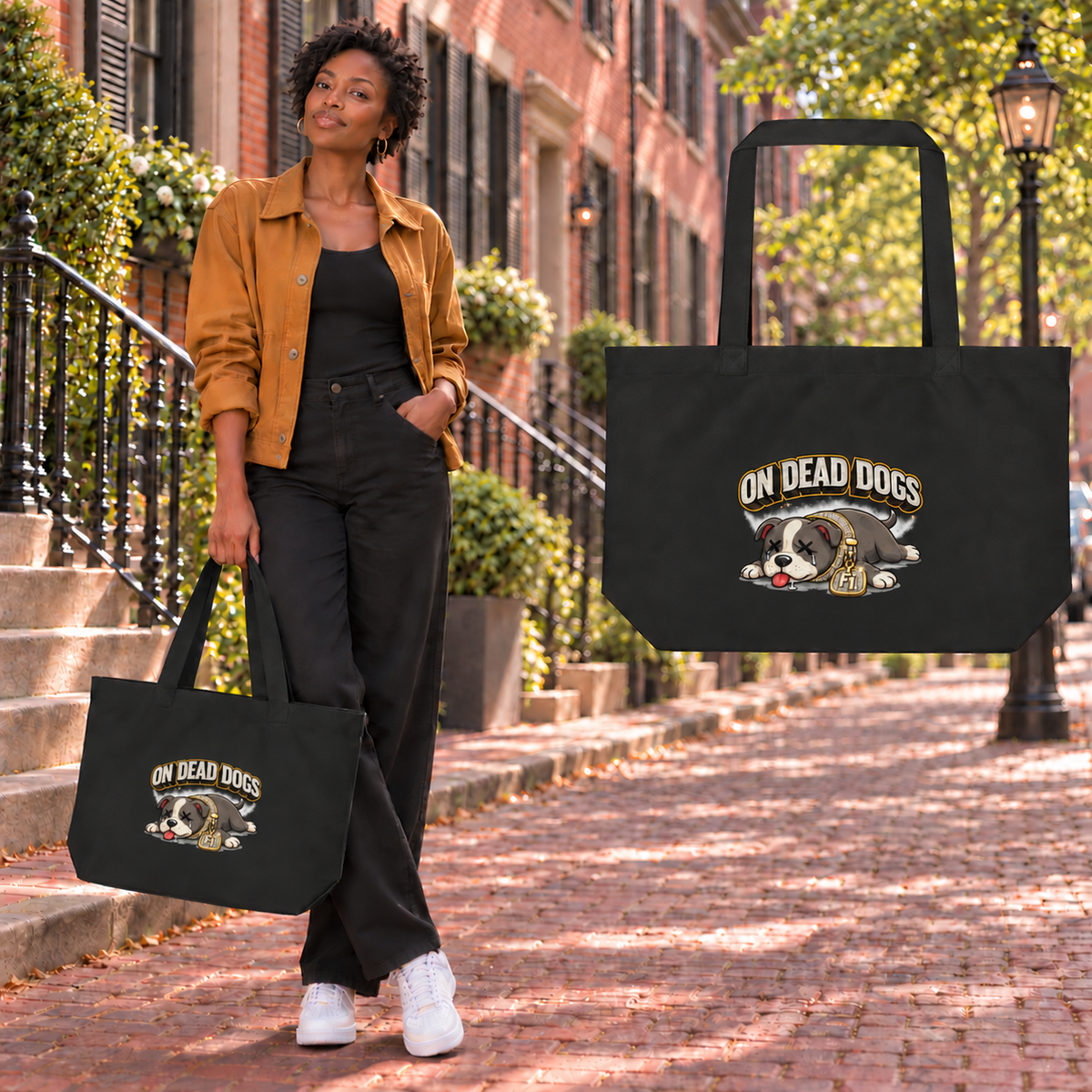 Black adult woman in Boston holding the On Dead Dogs large eco tote with enlarged 8-inch artwork and matching floating tote