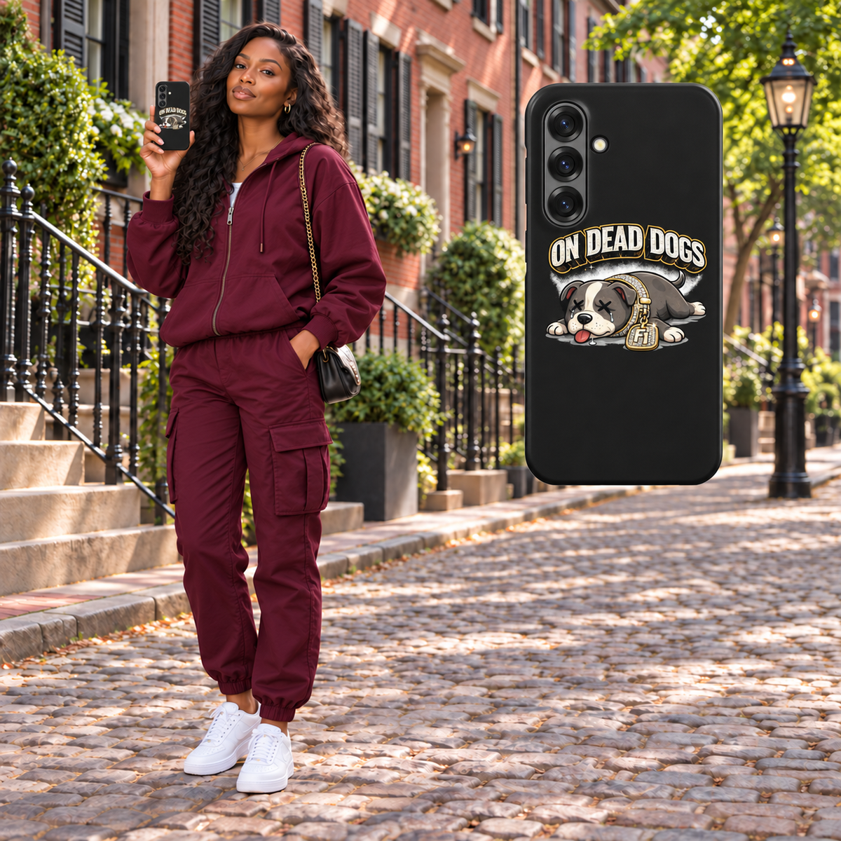 Black adult woman in Boston holding On Dead Dogs matte snap Samsung Galaxy S25 case, with matching floating case. Phone not included.