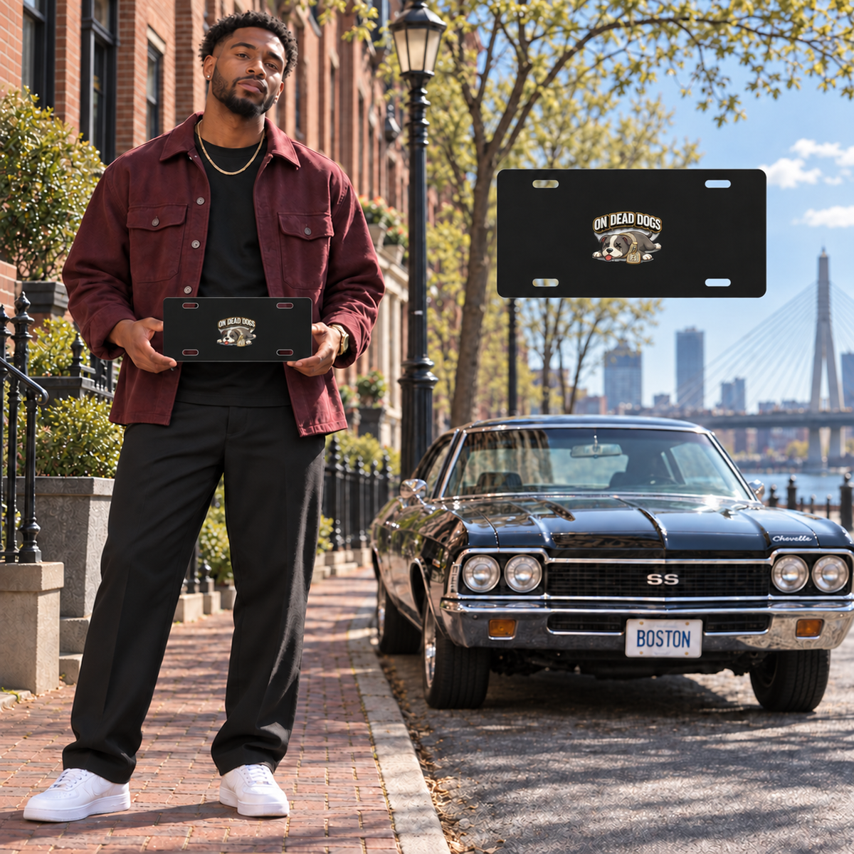 Black adult man posing with the On Dead Dogs black vanity plate in Boston, with matching floating plate view