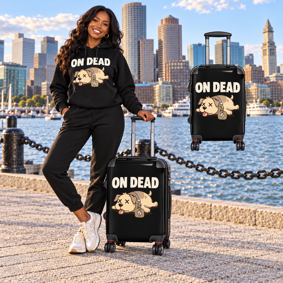 Black woman in matching On Dead hoodie with tan-dog suitcase on Boston waterfront and floating suitcase detail