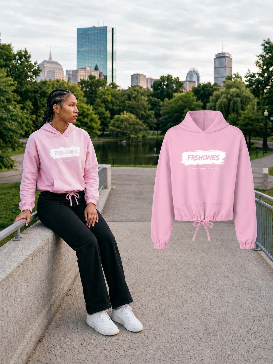 Female model seated in the Light Pink Stroke of Genius cropped hoodie beside the matching full-size floating garment at Boston Public Garden